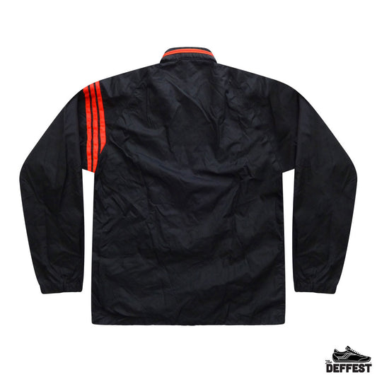 Black windbreaker jacket shown from the back, featuring three bright red stripes on the upper left shoulder and a red collar trim, photographed on a white background.